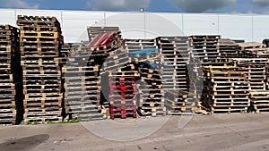 Wooden old Euro pallets or EUR-pallet for storing goods in the backyard of the store
