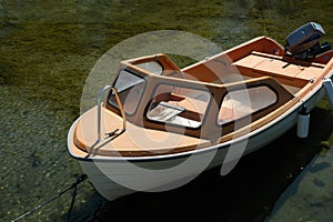 Wooden old motorboat in calm green water