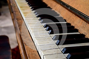 wooden old piano with piano key. Selective focus