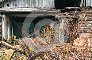 Wooden old ruined house in village