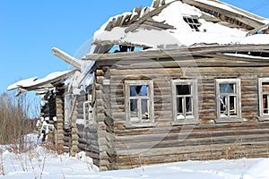 Wooden old ruined house in the village.