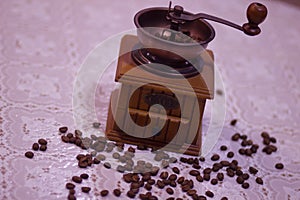 Wooden old vintage manual coffee grinder and coffee beans