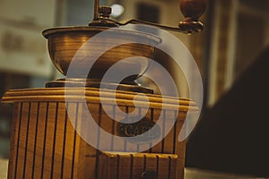 Wooden old vintage manual coffee grinder and coffee beans