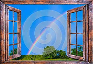 Wooden old window sky view with rainbow