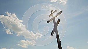 Wooden orthodox Cross in front of blue sky