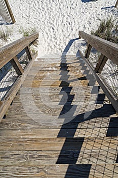 Wooden outdoor public staircase going down to the beach in Destin Florida