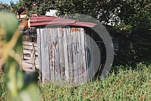 Wooden outdoor toilet in a village in rural Romania