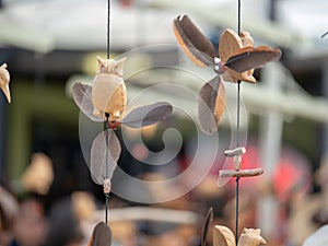 Wooden owl and humming bird Japanese ornaments hanging outdoors