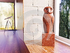 Wooden owl on the windowsill in apartment - 3D Rendering