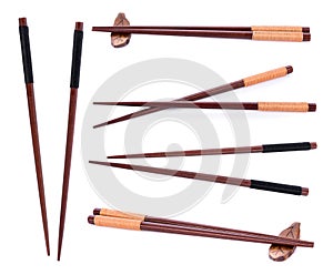 Wooden pairs of chopsticks on white background