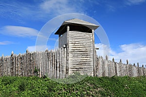 Wooden palisade with viking fortress tower