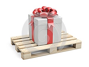 Wooden pallet with gift box, ribbons and red bow. Festive delivery