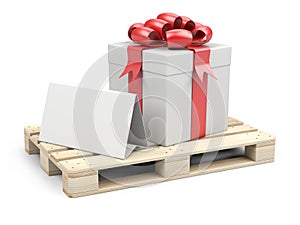 Wooden pallet with gift box, ribbons and red bow. With a template for congratulations