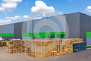 Wooden pallets heap in the cargo warehouse