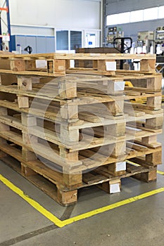 Wooden pallets in interior of factory