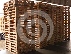 Wooden pallets stack at the freight cargo warehouse for transportation and logistics industrial