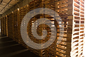 Wooden pallets stack at the freight cargo warehouse for transportation and logistics industrial