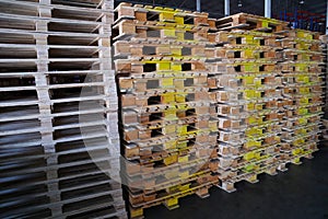 Wooden pallets stack at the freight cargo warehouse for transportation and logistics industrial, Driver forklift loading