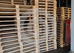 Wooden pallets stack at the freight cargo warehouse for transportation and logistics industrial, Driver forklift loading