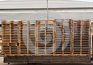 Wooden pallets stack on the truck at the freight cargo warehouse for transportation and logistics industrial