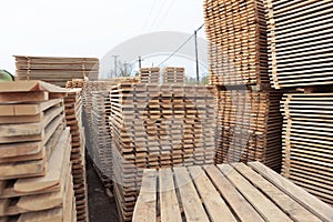 Wooden pallets for transportation of building materials. Wood harvesting workshop. The woodworking industry.