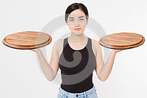 Wooden pan. Young asian woman in summer tshirt holding empty pizza tray isolated on white background. Copy space and mock up.
