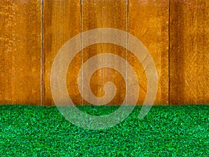 Wooden panel with green grass