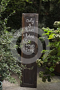 Wooden panel with restaurant rules