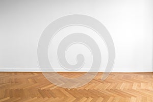 Wooden parquet floor and white wall background - empty room , ne