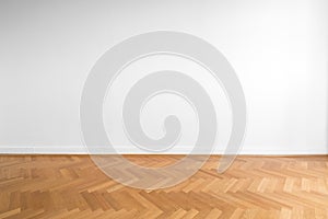 Wooden parquet floor and white wall background - empty room , ne photo