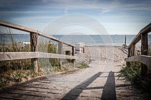 wooden path leads over the dunes to the Baltic Sea beach