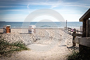 wooden path leads over the dunes to the Baltic Sea beach