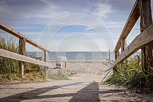 wooden path leads over the dunes to the Baltic Sea beach