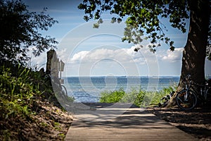 wooden path leads to the beach of the Baltic Sea