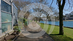 Wooden Path in a Moden City Park, sunny day. Granville Island in False Creek, Vancouver, BC, Canada