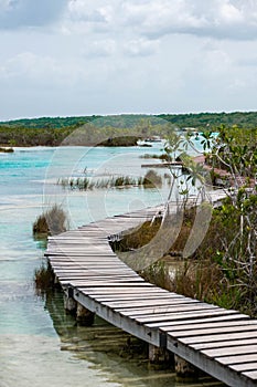 wooden path next to the rapids near bacalar lagoon, mexico