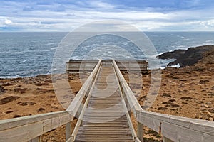Wooden path and stairs to Blowholes viewpoint at Cape Bridgewater in Victoria, Australia. photo