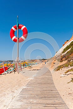 Wooden path to Falesia Beach in Portugal photo