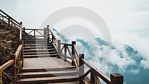 Wooden path with view of mountain covered by clouds on Wugong Mountain in Jiangxi, China