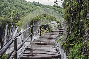 Wooden pathway near big waterfall, Plitvice Lakes National Park, Croatia