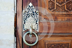 Wooden pattern in door with boor handle in Tashkent, Uzbekistan