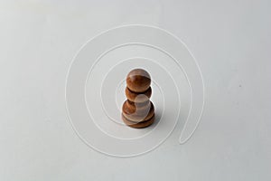 Wooden paw chess figure on grey background