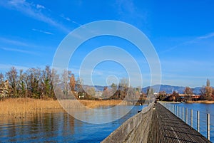 Wooden pedestrian bridge over Lake Zurich in Switzerland