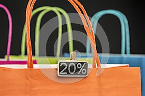 Wooden peg tag on shopping bags