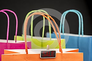 Wooden peg tag on shopping bags