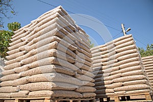 Wooden pellets in plastic bags on a beg stacks