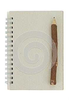 Wooden pencil and recycled notebook