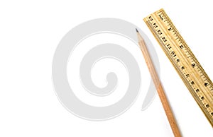 Wooden pencil an ruler on white isolated background