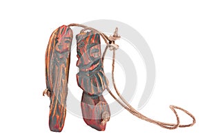 Wooden pendant amulet in the form of an inseparable pair of men photo