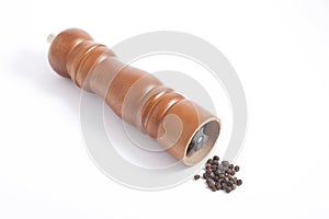 Wooden pepper grinder and pepper grains